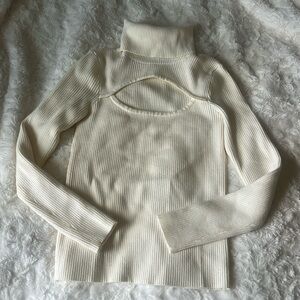 Cream turtleneck sweater with keyhole cutout